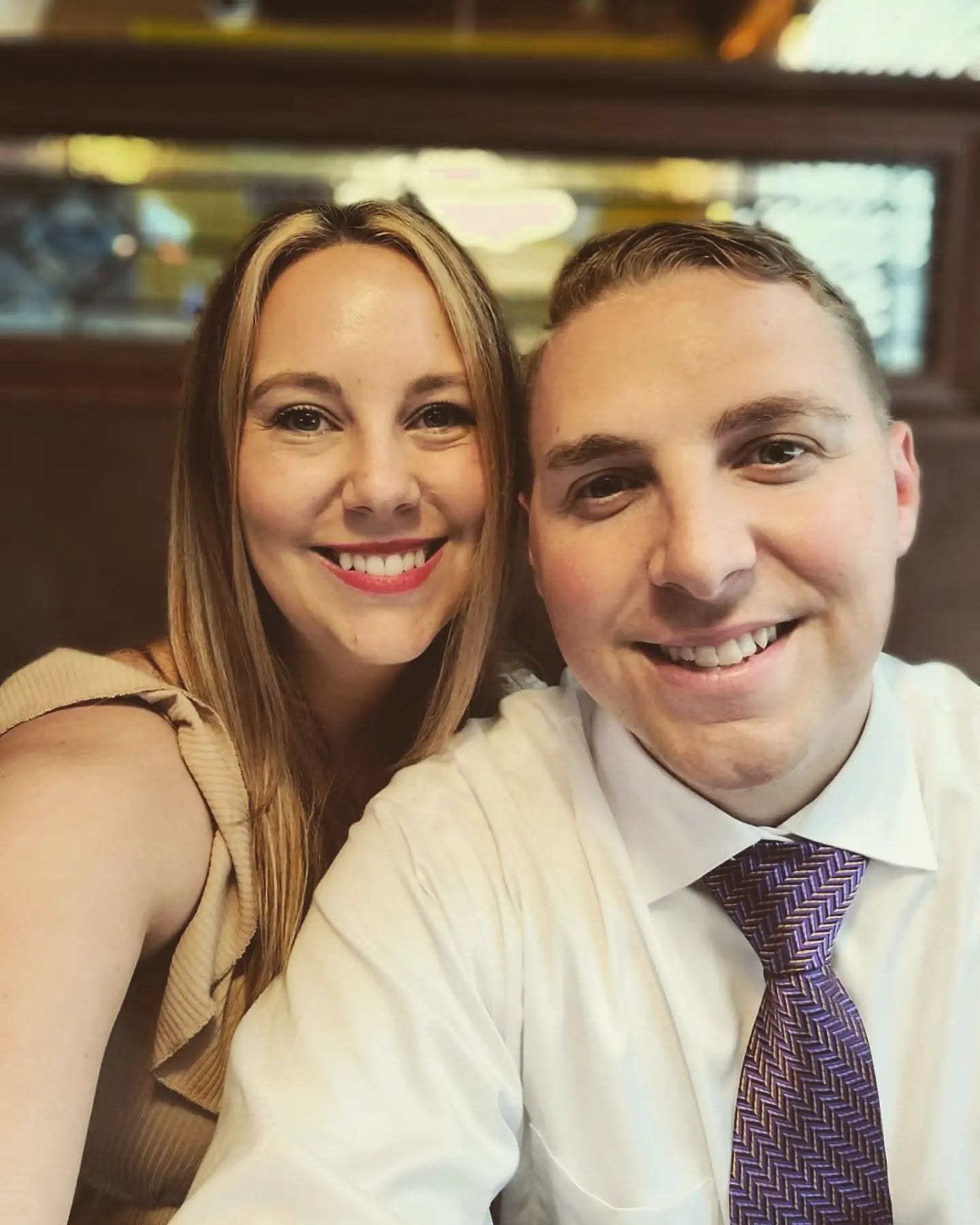 Devyn Harrington celebrating graduation with his wife