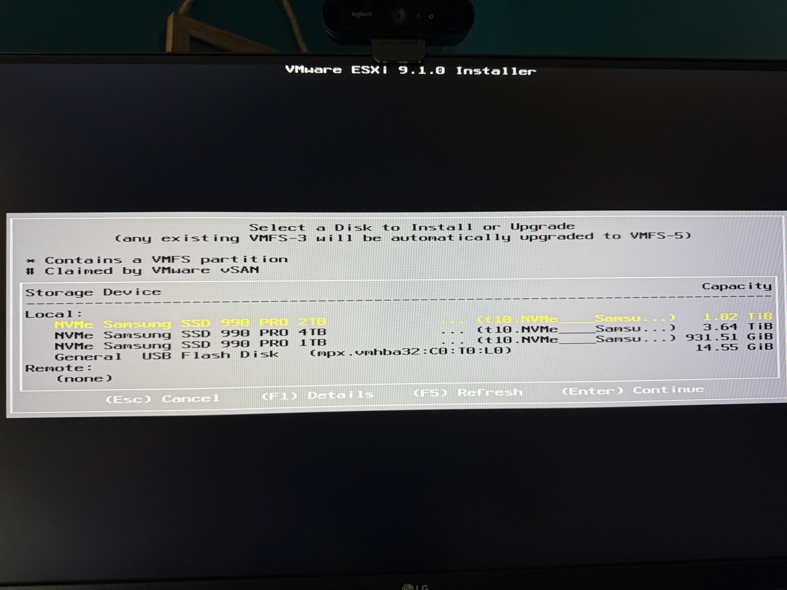 VMware ESXi 9.1 installer showing the 2 TB, 4 TB, and 1 TB Samsung 990 PRO devices with the 2 TB device selected